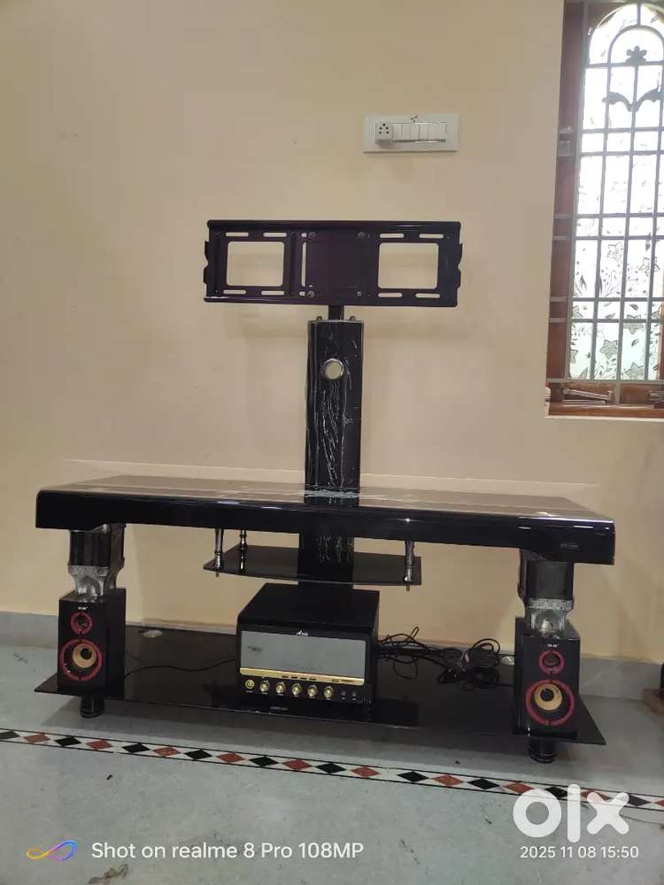 TV stand with attached 1 ooper 2 speakers