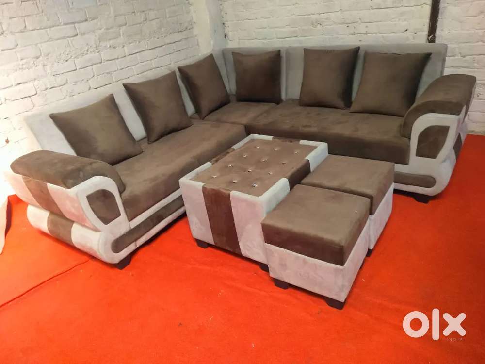 Corner sofa set with Tea table with two puffy table