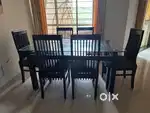 Glass top wooden dining table