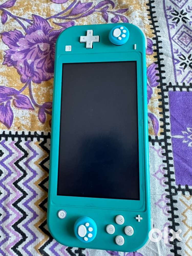 Nintendo Switch Lite + Charger. Get FC 24 game free worth Rs. 3500