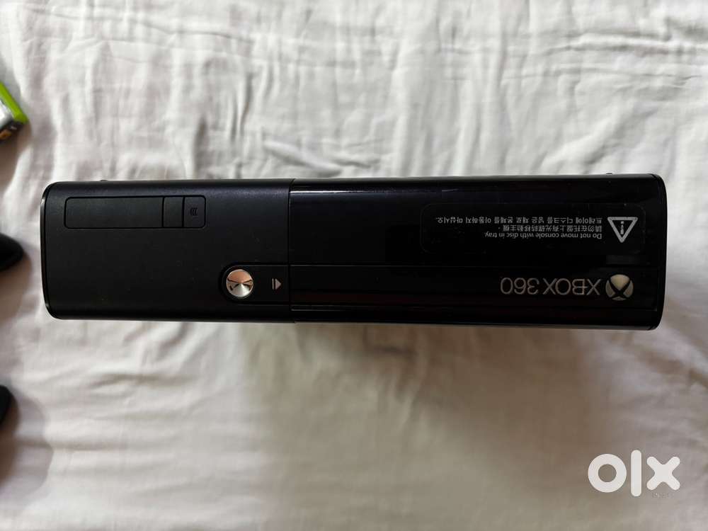 X box 360 gaming console with steering wheel