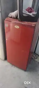 Red colour single door fridge proper working condition good cooling