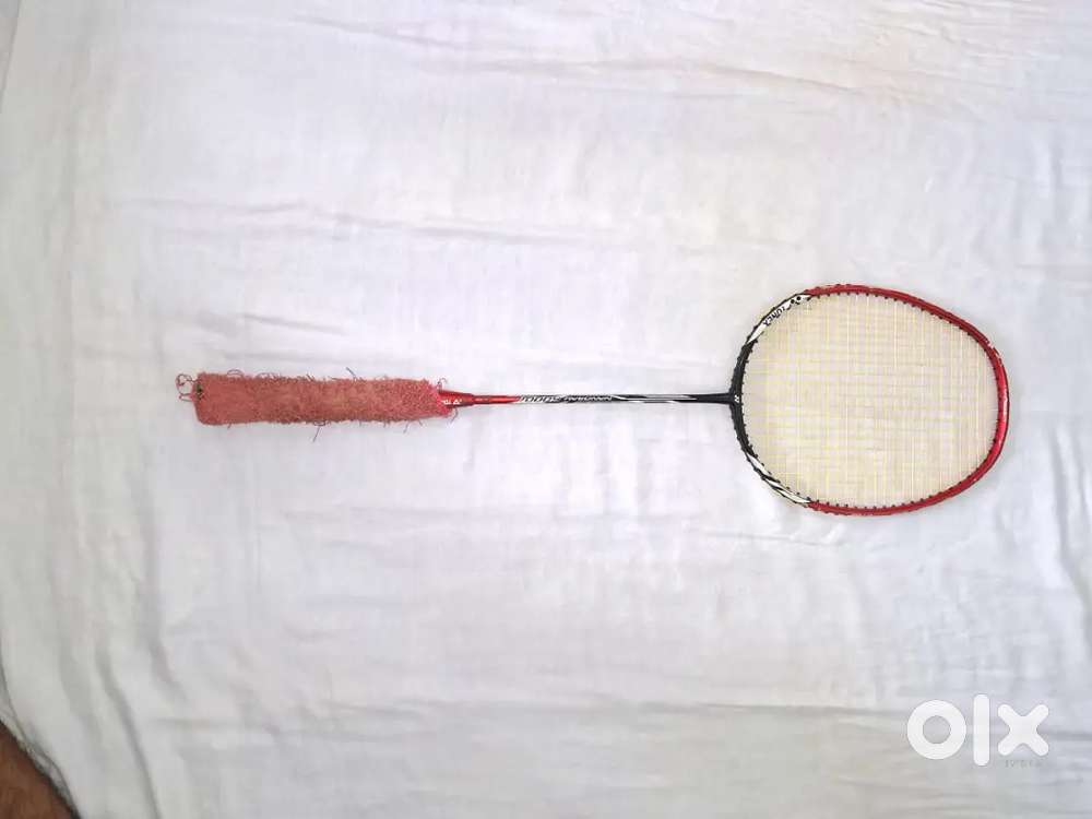 Nanoray 6000i in red colour with grip and strung in yellow colour