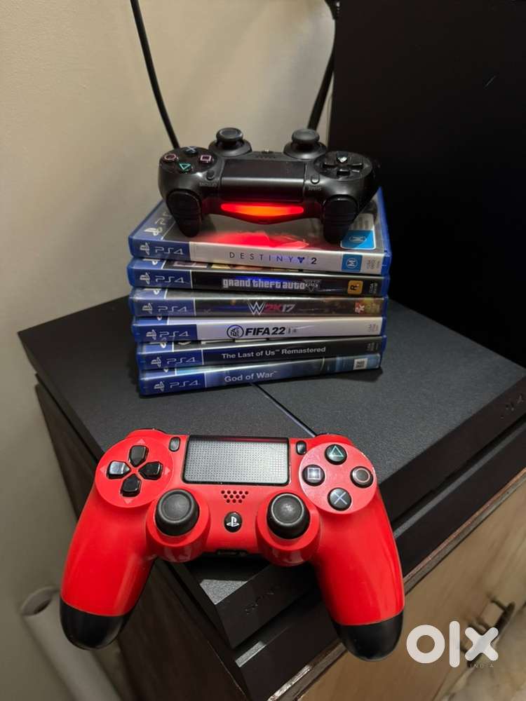Sony PlayStation 4 (PS4) with 2 controllers