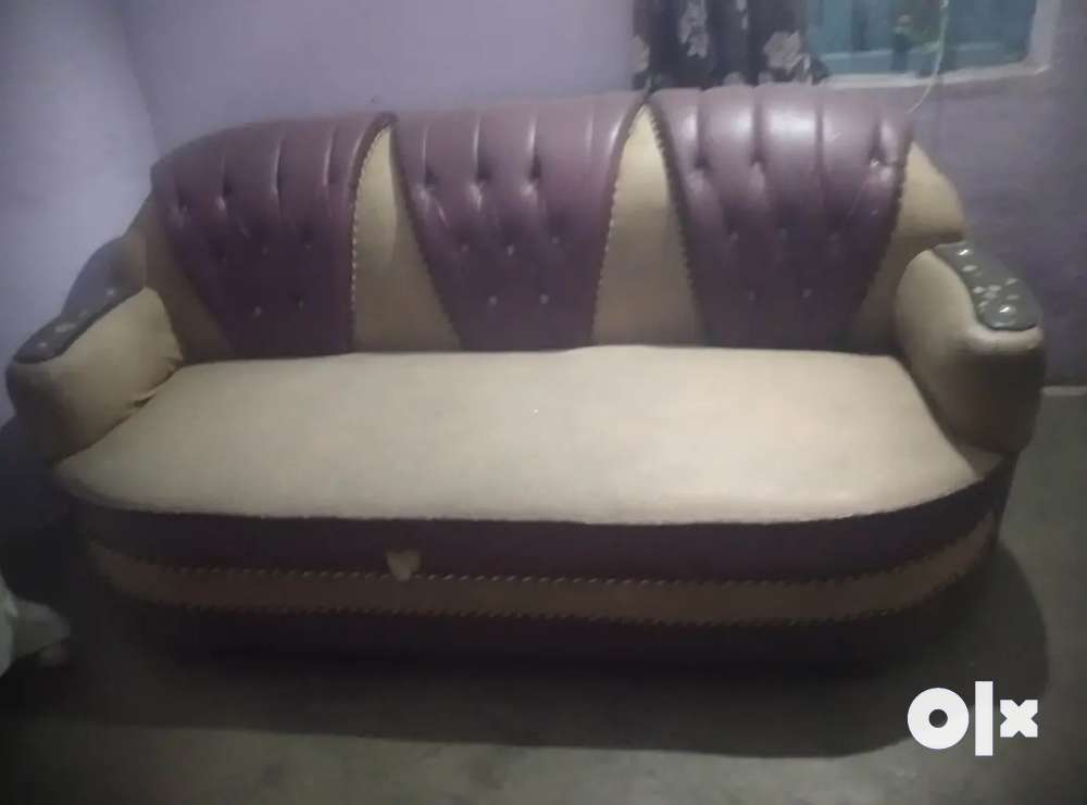 Maroon coloured sofa