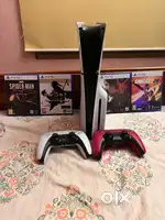 PS5 slim disc edition with  2 dual sense controllers and 4 disc games