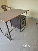 Table and revolving chair