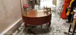 Heavy Wooden round table with glass top.