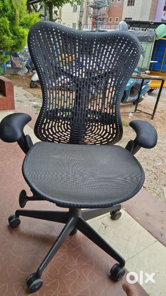 Herman Miller Mirra 1 chairs are available with adjustable arms