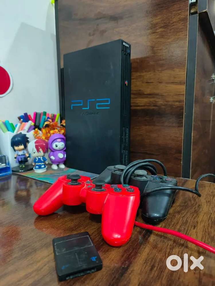 PlayStation 2 with games and consoles