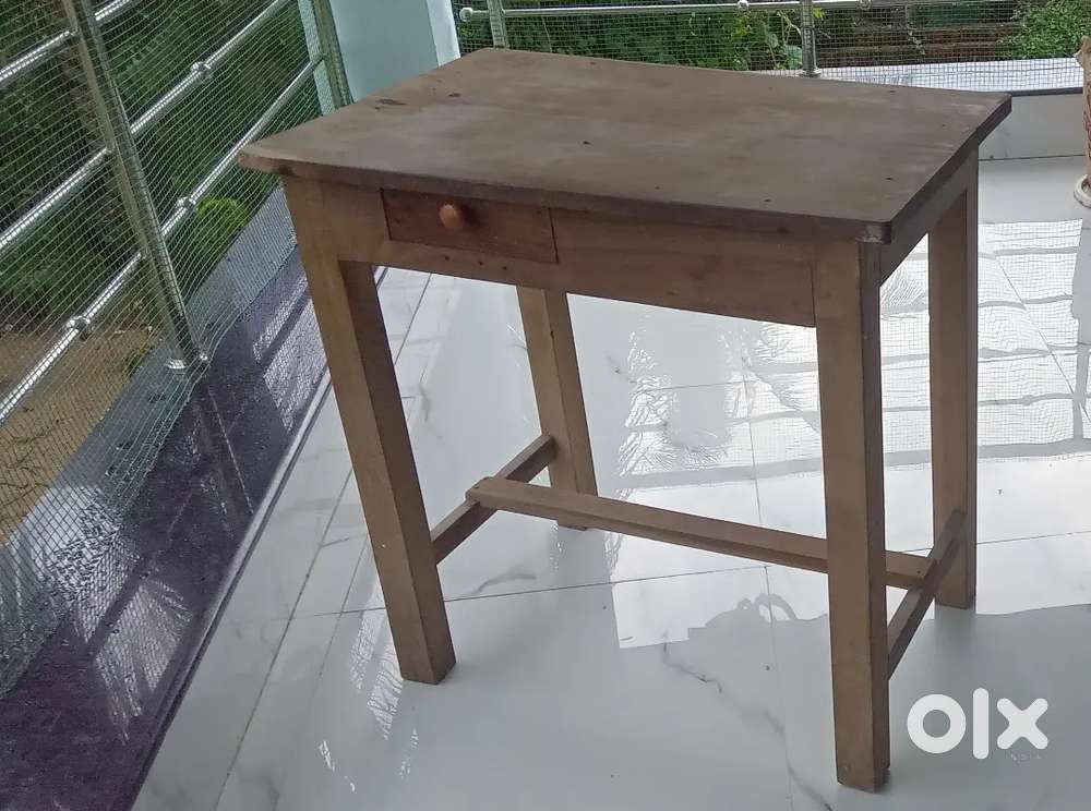Heavy wooden study cum laptop table.