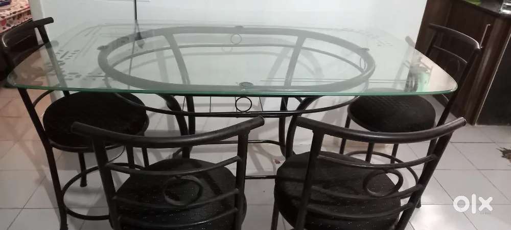 4 seater glass top dining table with chairs