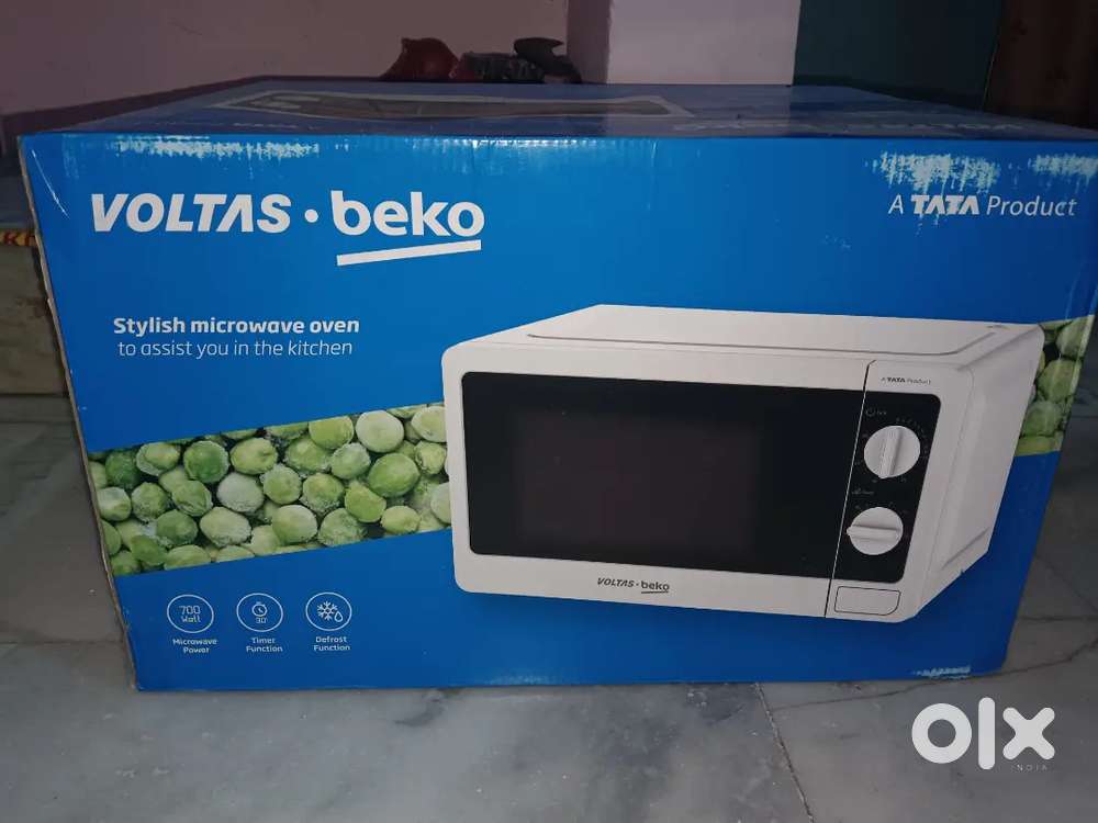NEW MICROWAVE OVEN