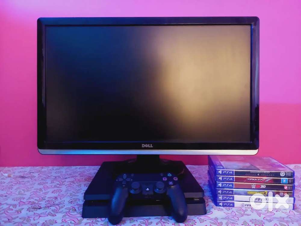 Playstation 4 with controller and 7 games