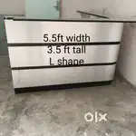 L shape table, racks, door, ceiling fan