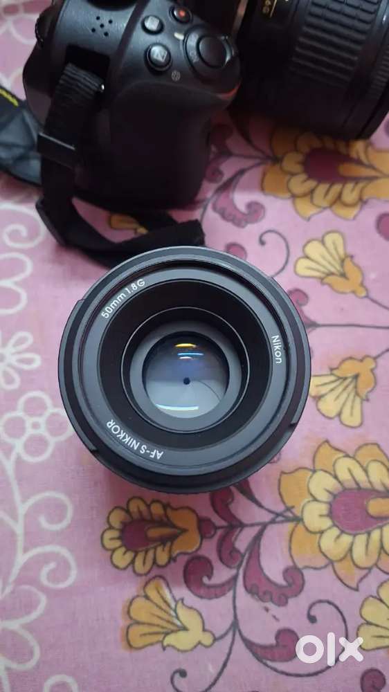 Nikon 50mm AF Standard Prime Lens and hood.