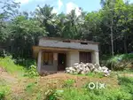 1 acre 24 cents with 2 bhk house semi furnished .Road facing