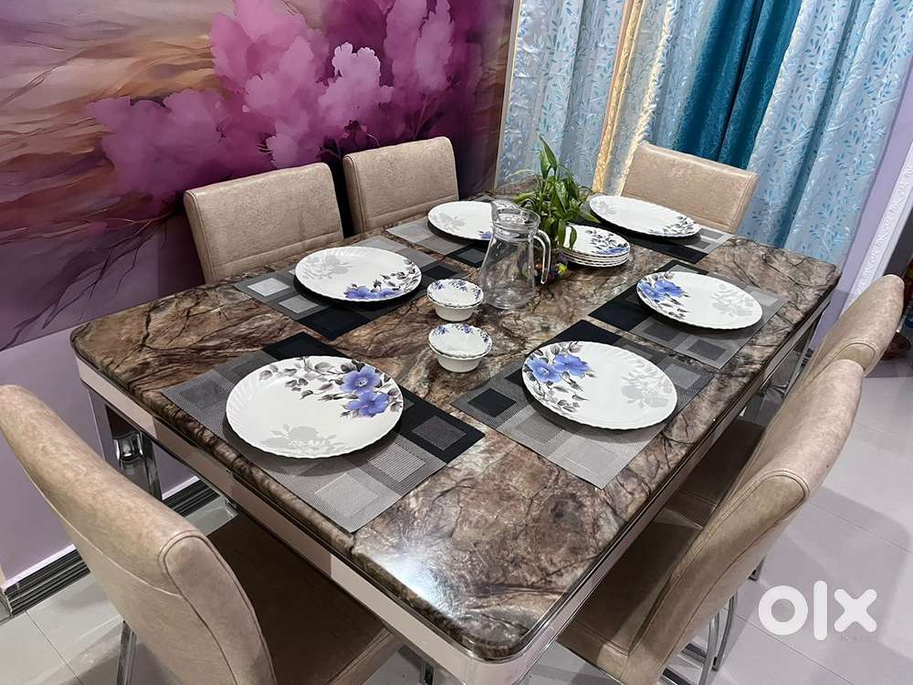 6-seater marble top dining table