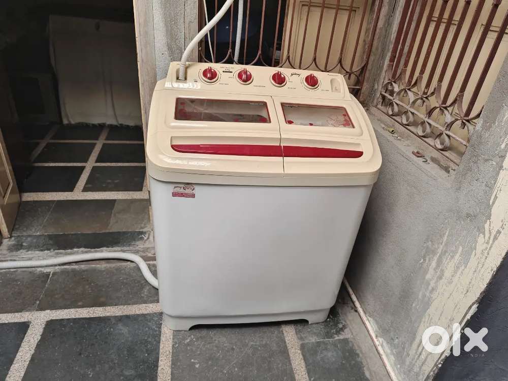 Caption: 8kg Godrej semi-automatic washing machine in best condition.