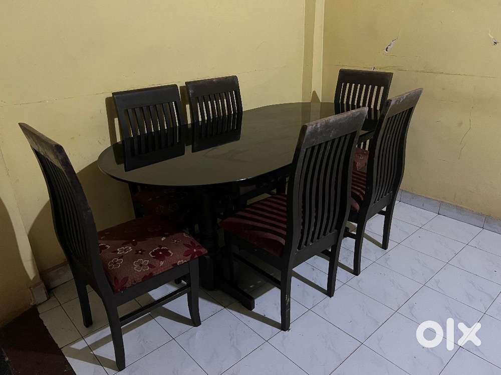 Rarely used Glass top Six seater Dining table with chair