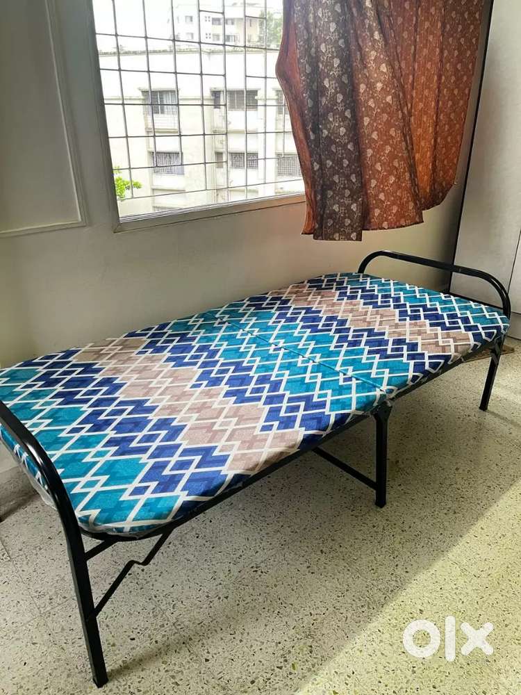 Folding metal bed