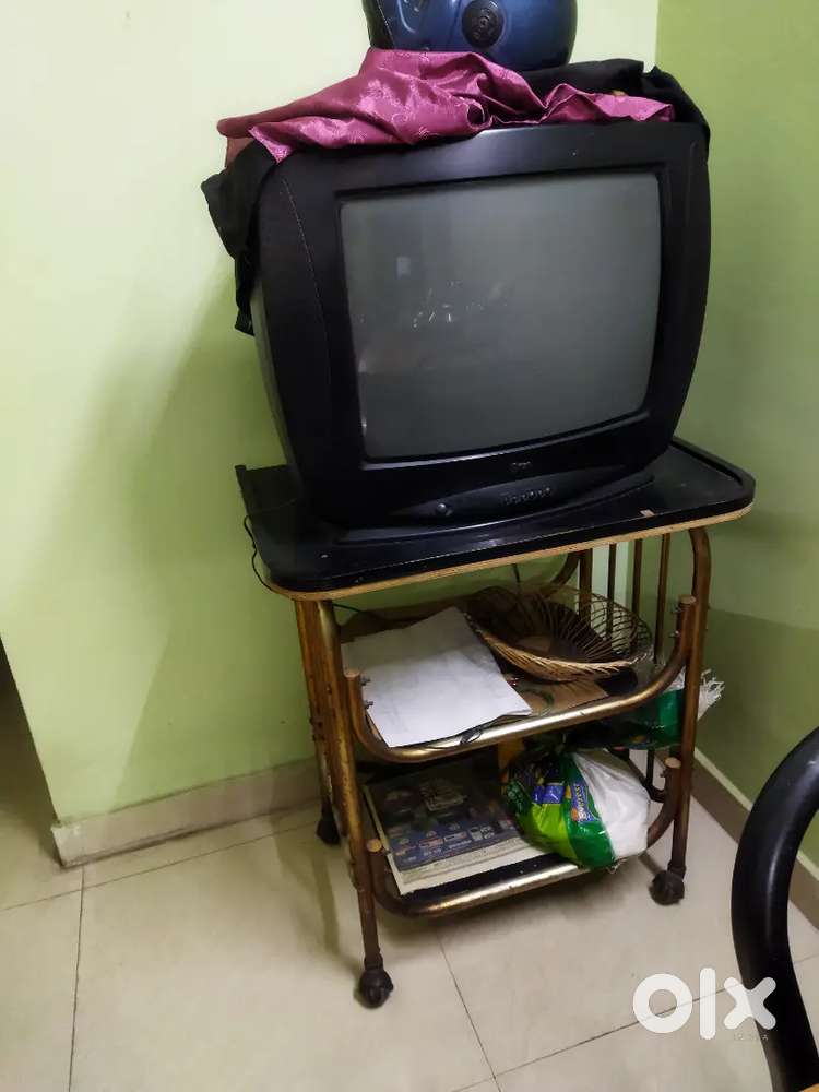 Old LG TV with a sturdy matching stand.