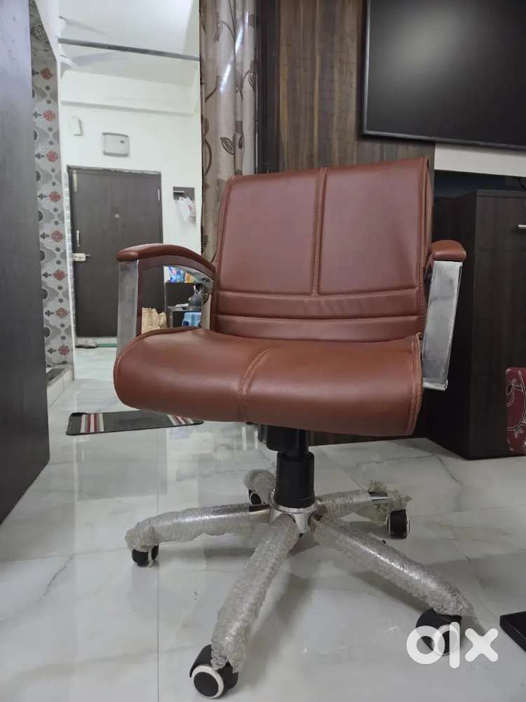 Leather office chair tan color rotate and adjustable @2500