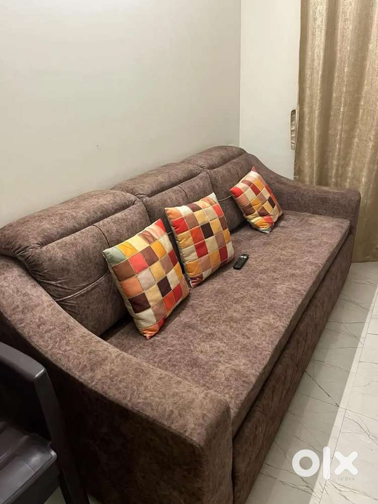 Sofa cum bed with puffy