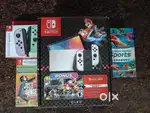 Nintendo Switch OLED (White) – New, Sealed + 2 New Controllers & Games