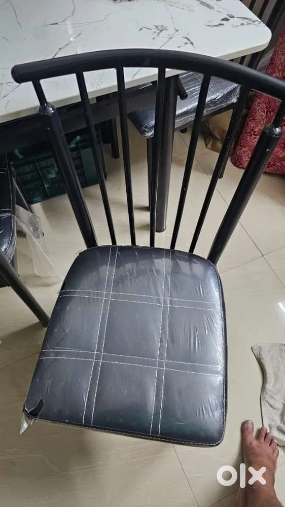 Marble top dining table with 4 cushioned chairs