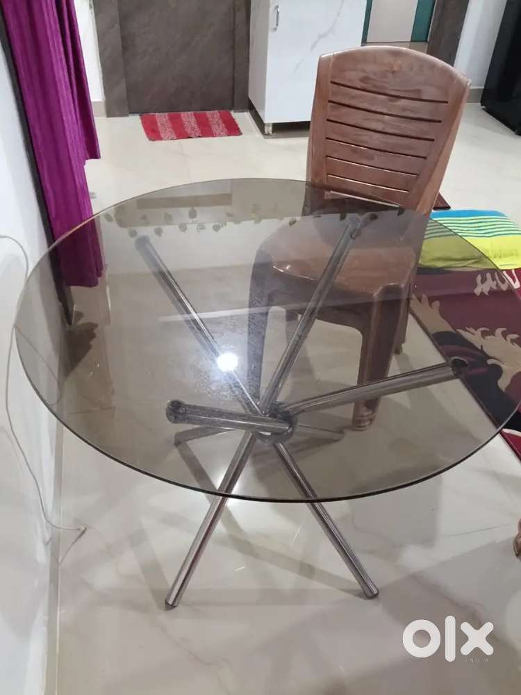 Selling round dining table as relocating