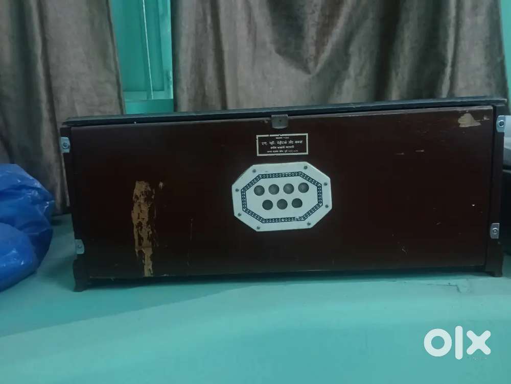 A Harmonium with casing.