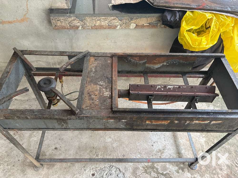 Snacks cupboard , porotta griddle and stove , glass sliding shelf,