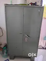 Metal cupboard and folding bed