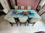 Dining table with eight cushion chairs
