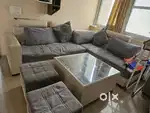 L shape grey and white sofa with centre table