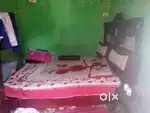 Wooden Double bed and iron a dressing table shifting my home to