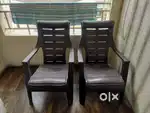Double bed with mattress and plastic chairs
