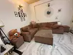 L-shape 7 seater sofa with center glass table and 2 puffies