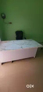 White counter table for office. And rolling chair.