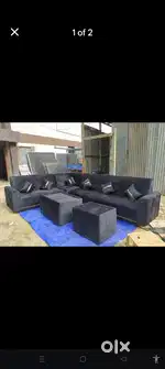 L shaped sofa 9 seater with two extra tools two tables and cushions