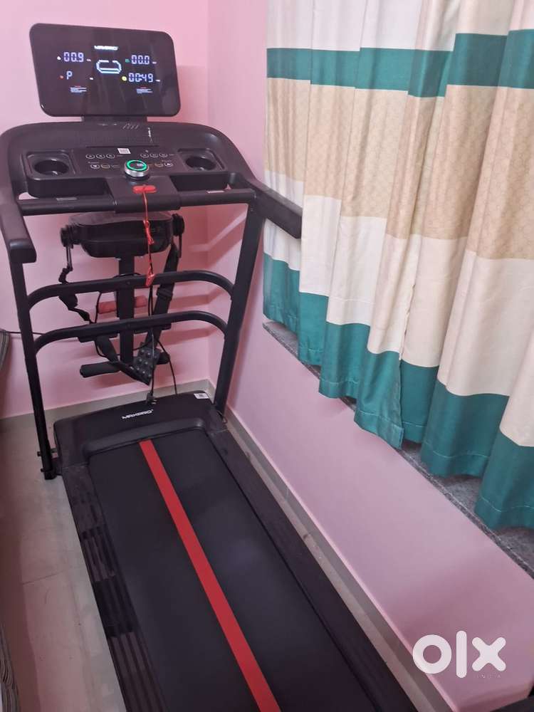 Running treadmill with massager