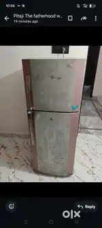 double door LG fridge and old iron bed