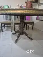 Round dining table with chairs and center table