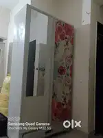 Mirror with dressing and couberd and single sofa and scooty
