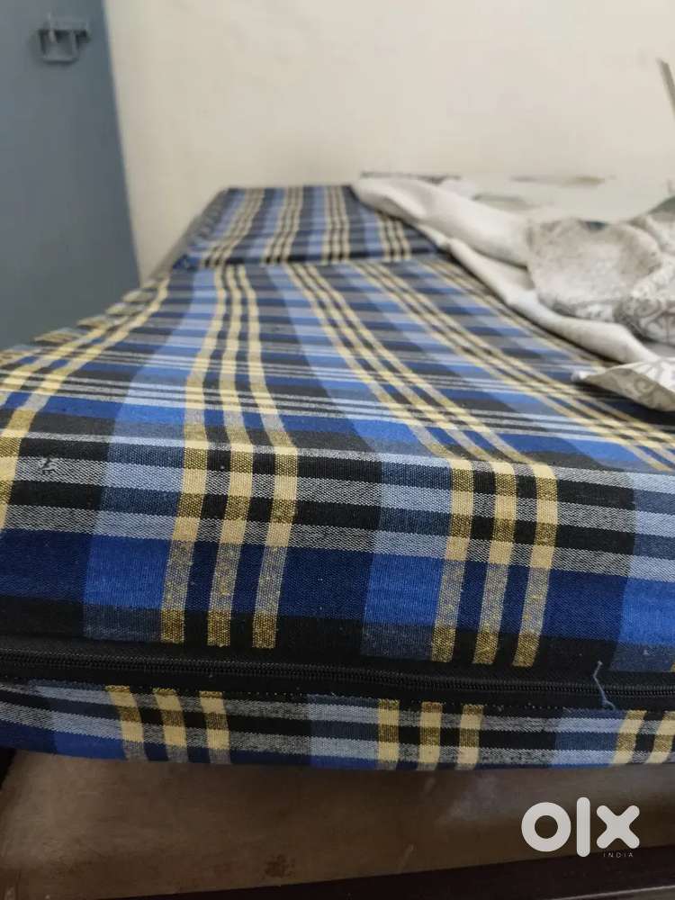 Mattress with cover. Each matters is 2999 Rs . One plastic Table 900/-