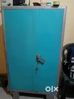 Used steel almirah and two plastic chairs