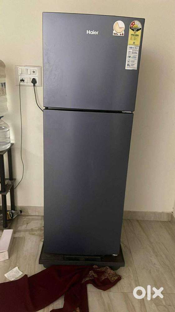 Wooden double bed and refrigerator