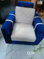 A single sofa, White and blue colour.