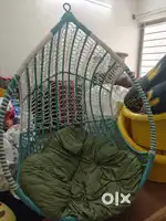 Swing with cushion and 3 chairs together